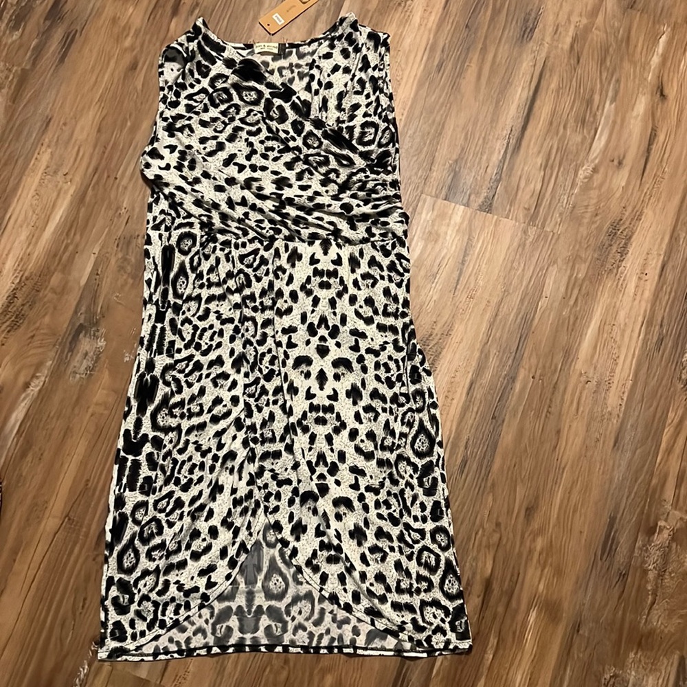 Stretchy black and white faux wrap dress with slit